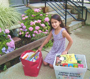 Rachel delivering books to Astor's Head Start program