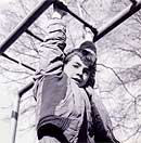 boy on climbing bars