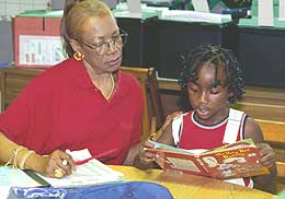 teacher reading with girl