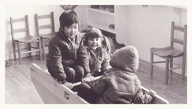 toddlers in rocking toy